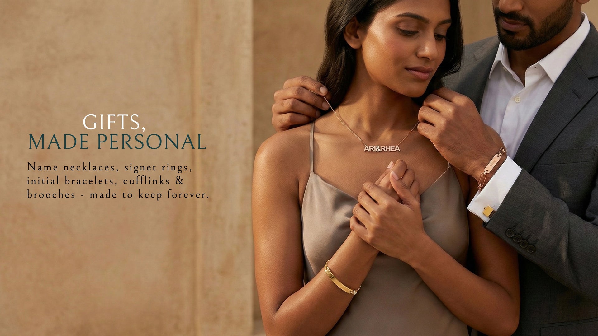 Man adjusting a necklace on a woman with text about personalized gifts.